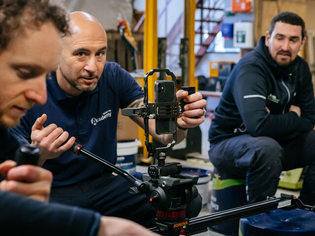 Guy tinkering with a camera